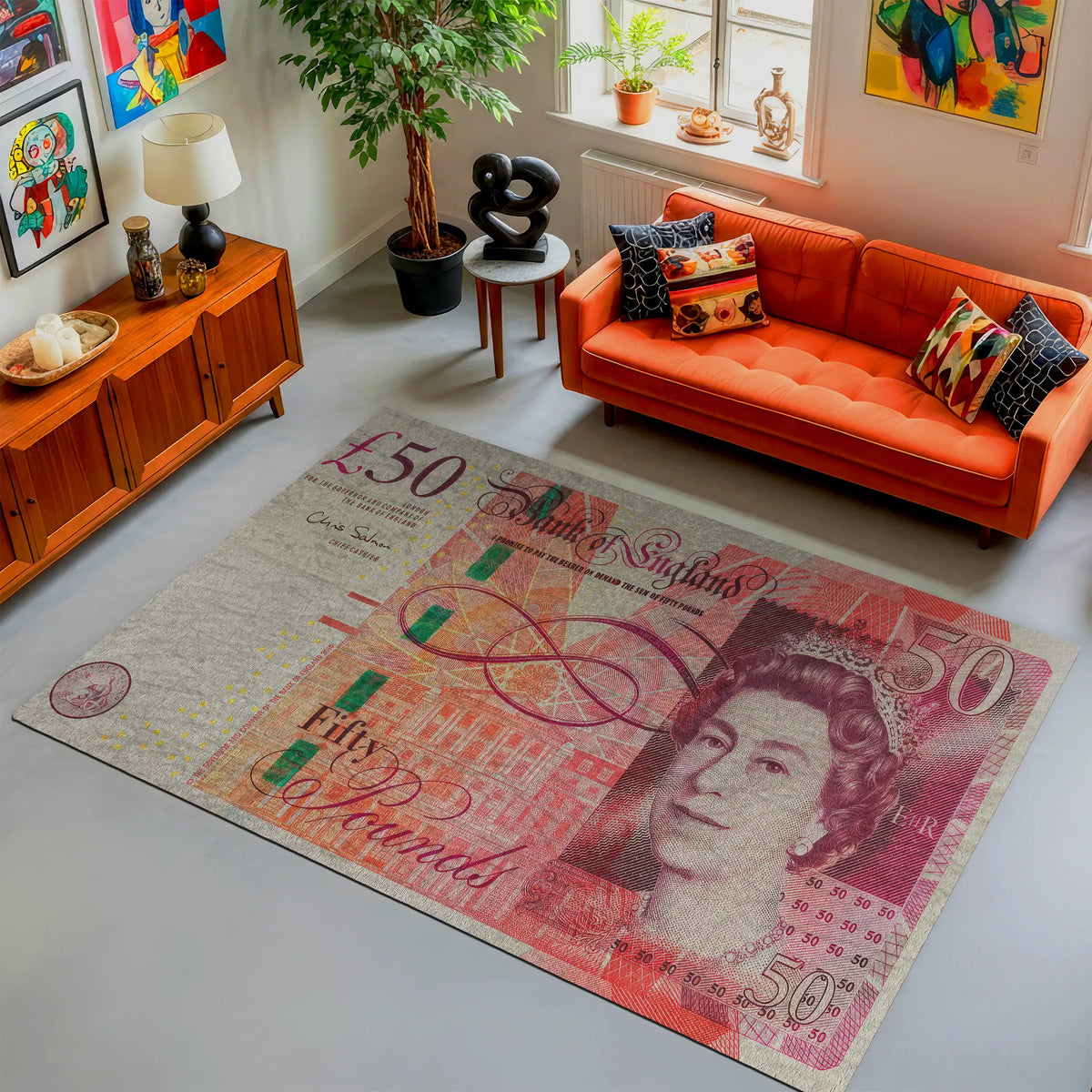 Living room with an orange sofa and a large £50 banknote rug.