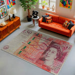 Living room with an orange sofa and a large £50 banknote rug.