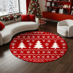 Round red rug with Christmas tree pattern in a living room with a decorated tree and presents.

