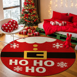 Round red Christmas rug with 'HO HO HO' text in a festive room with a tree and presents.

