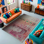 Living room with colorful furniture and a decorative rug featuring a portrait.