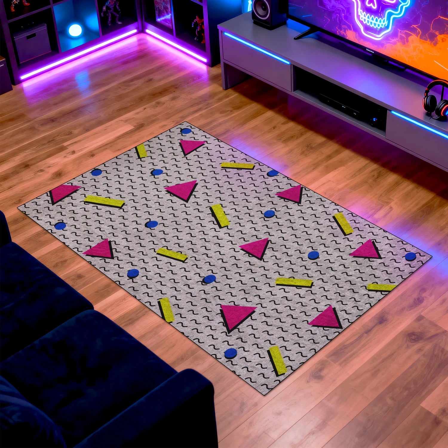 Retro Memphis style rug with pink, yellow, and blue shapes in gaming room