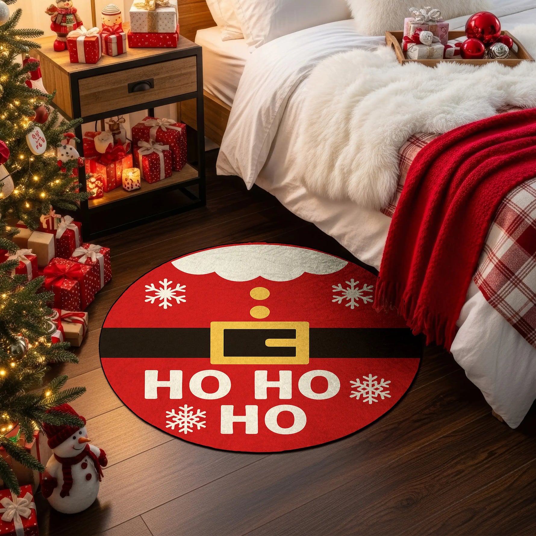 Christmas-themed room with a red rug featuring Santa Claus design, fireplace, and Christmas tree.

