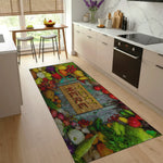Colorful kitchen rug with vegetables and a wooden sign on a wooden floor.