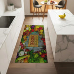 Colorful kitchen mat with vegetables and 'Luxe' text on a wooden floor.