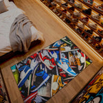 Colorful rug with shoe design on a wooden floor next to a bed