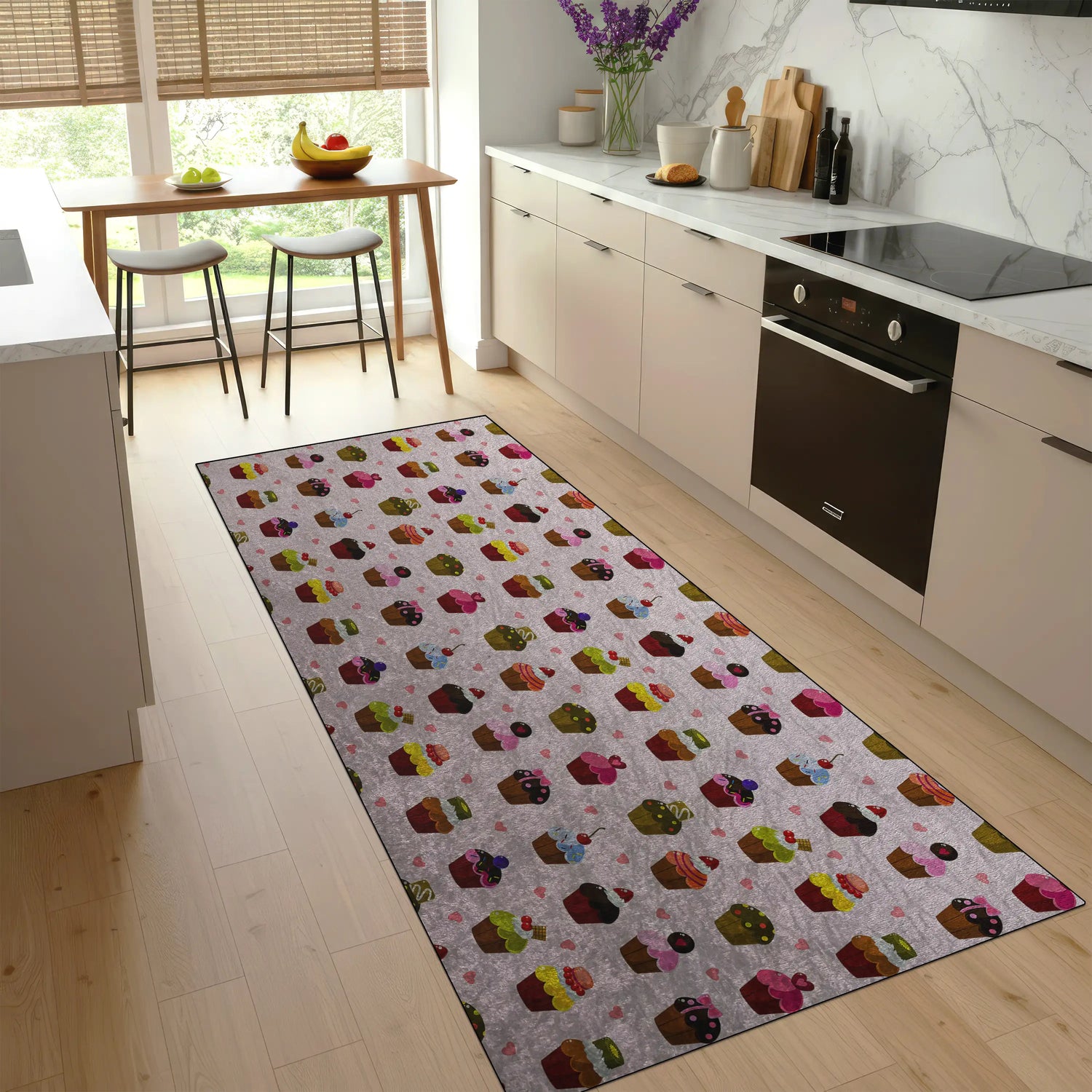 Colorful patterned rug on a wooden floor in a kitchen.
