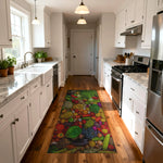 Kitchen with a colorful fruit-themed rug on wooden flooring


