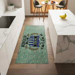 Light blue kitchen rug with quote about sleeping in kitchen