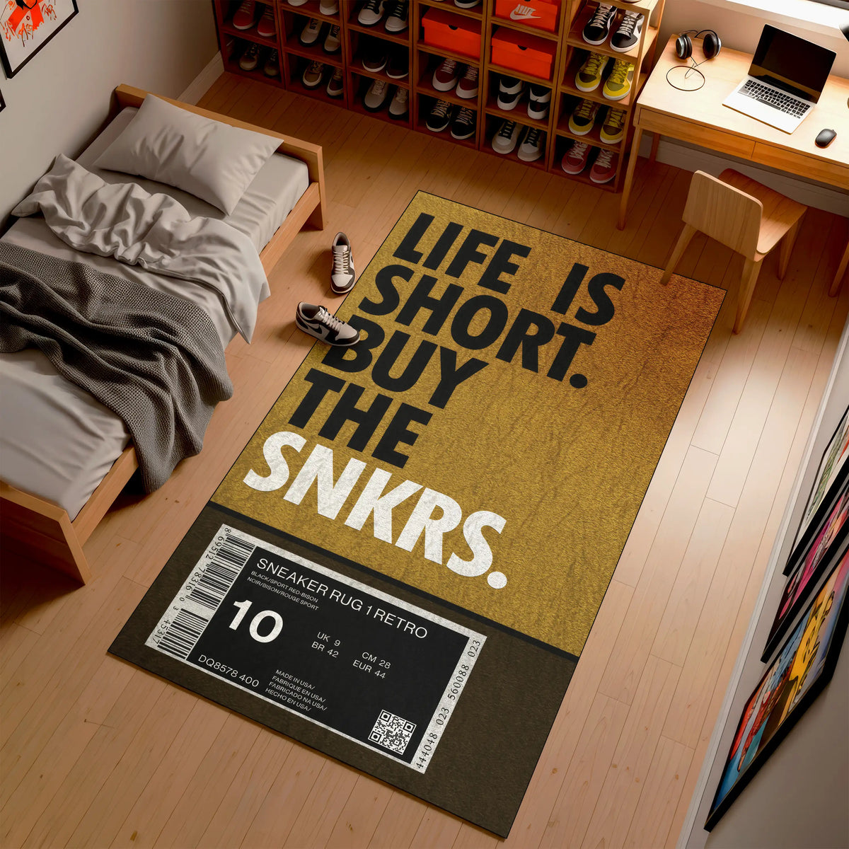 Doormat with 'Life is short, buy the snkrs' text in a room with a bed and shelves.

