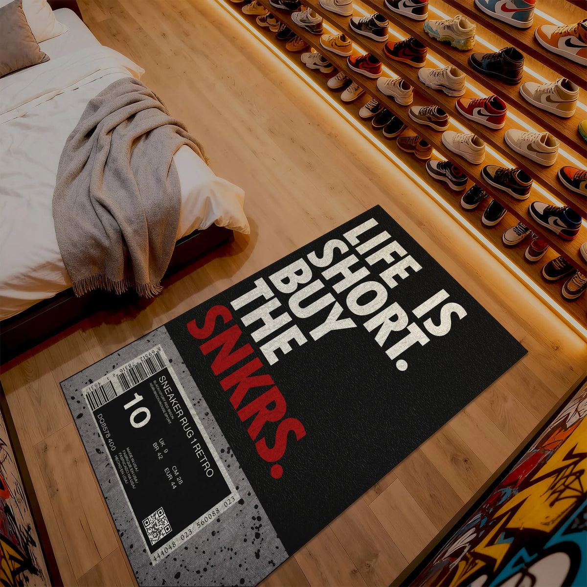 Doormat with 'Life is short, buy the snkrs' text on a wooden floor.

