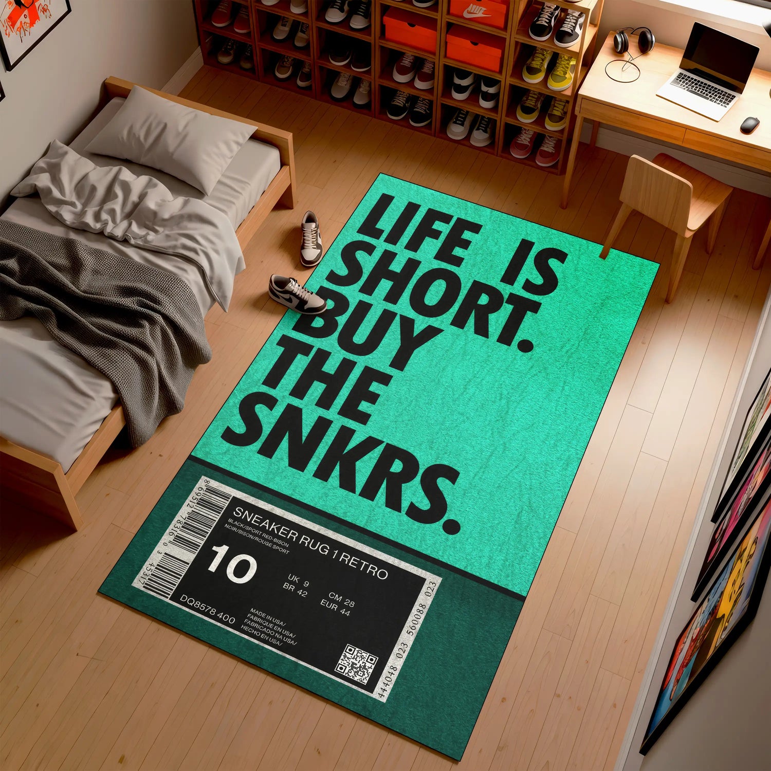 Green rug with 'Life is Short, Buy the Snkrs' text in a room with a bed and desk.

