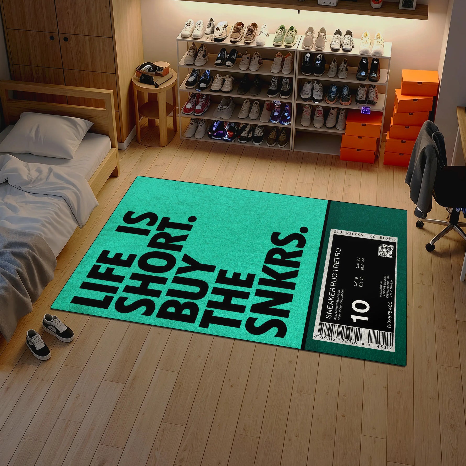 Room with a green rug featuring text and a sneaker box on the floor.

