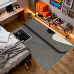 Room interior with a gray rug, bed, and shelves with shoes

