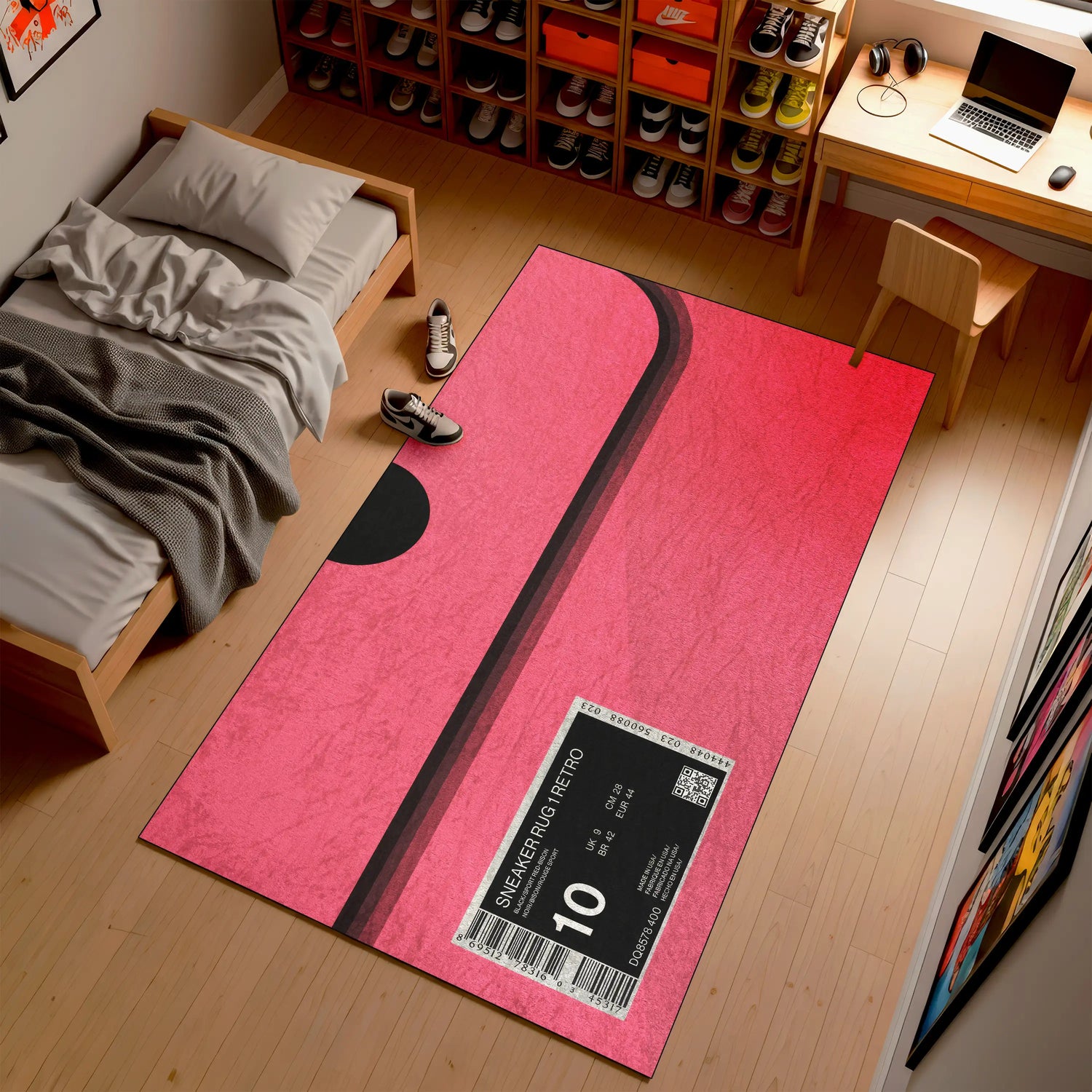 Pink and black mat with a shoe size label on a wooden floor in a room with a bed and desk.

