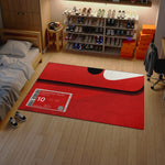 Red mat with sneaker release event details in a room with shelves of shoes and furniture.

