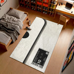 Room interior with a large rug featuring sneaker branding on a wooden floor.

