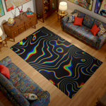 Living room with a colorful rug featuring a rainbow pattern on a wooden floor.