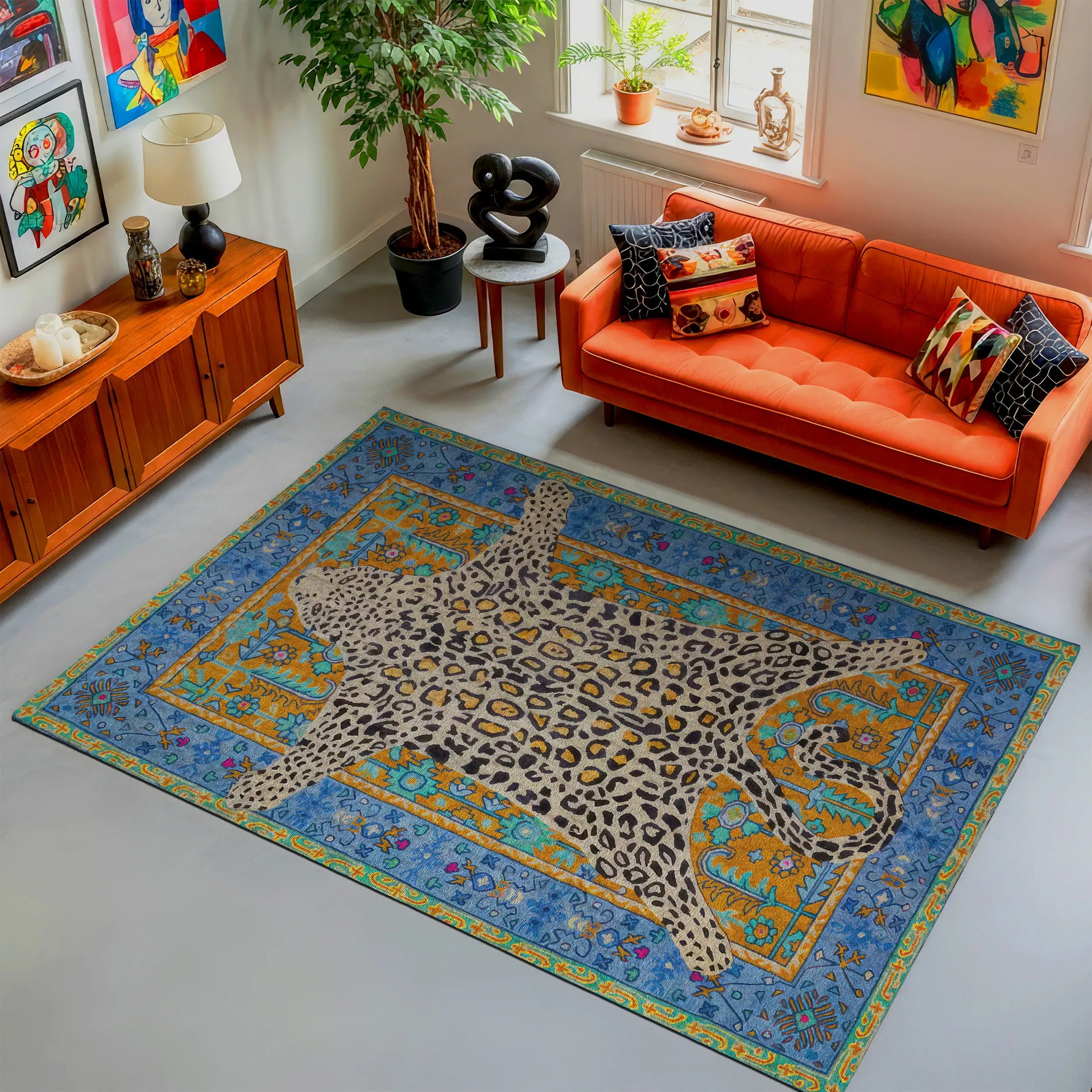 Living room with an orange sofa, colorful rug, and decorative items.