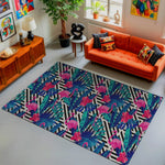 Living room with an orange sofa, colorful rug, and decorative items.