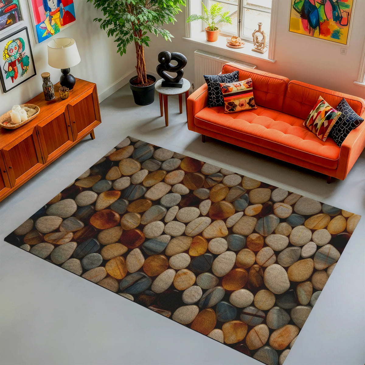 Living room with an orange sofa, colorful pillows, and a stone-patterned rug.