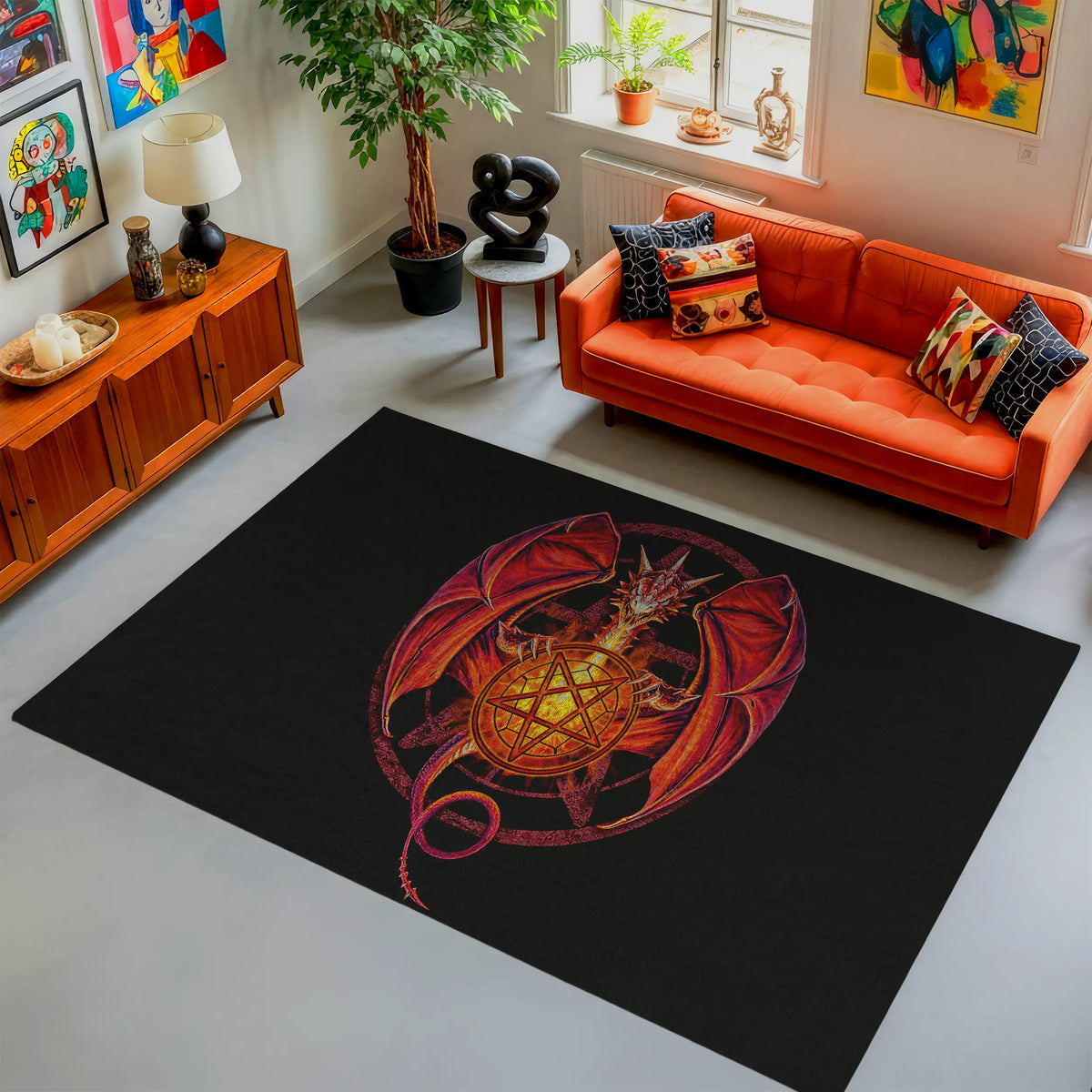 Living room with an orange sofa, black rug with a central design, and decorative items.