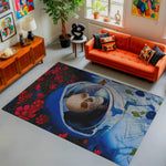 Living room with an orange sofa, colorful rug featuring a skull design, and various decor items.