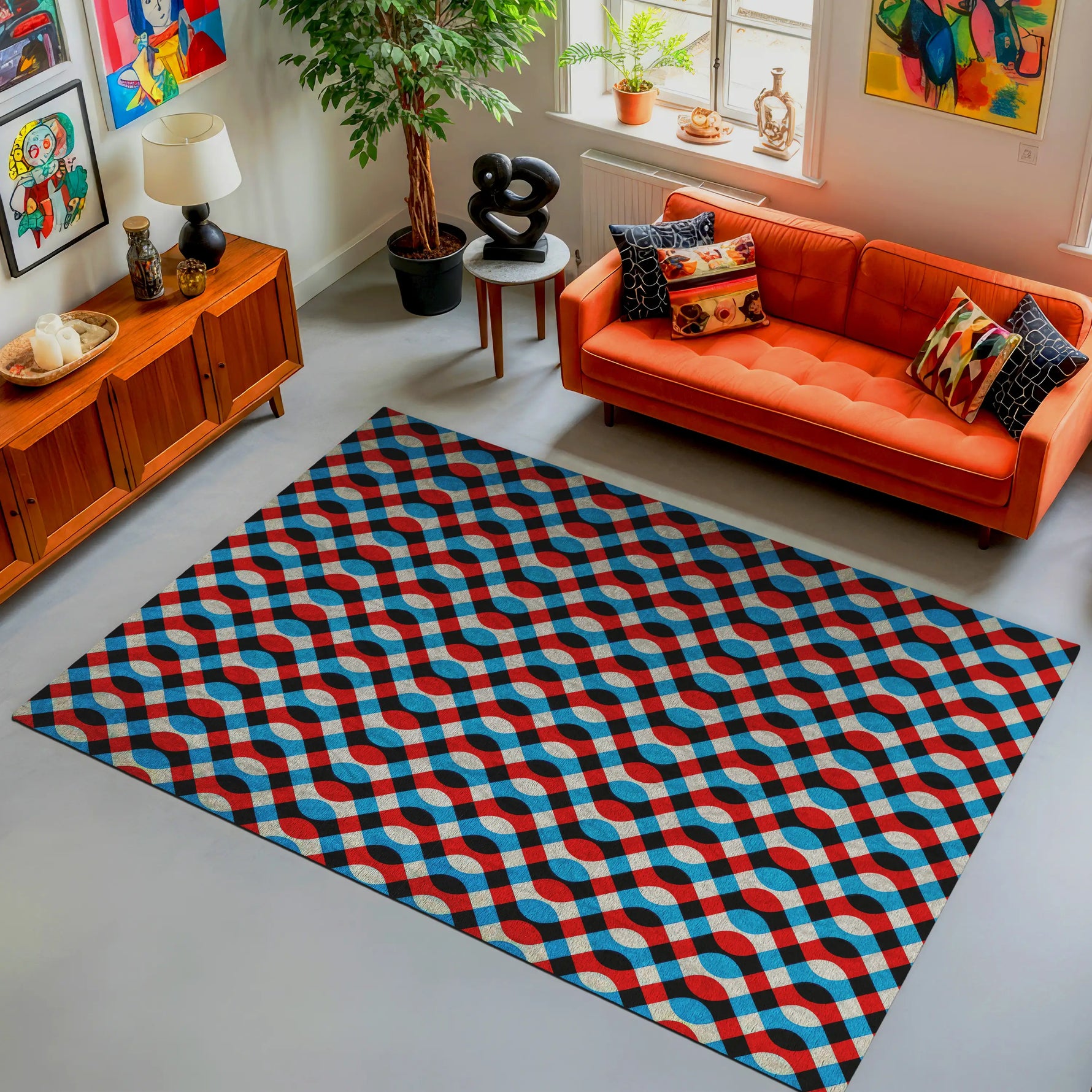 Living room with a geometric patterned rug, orange sofa, and decorative items.