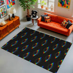 Living room with an orange sofa, colorful rug, and decorative items.