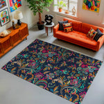 Living room with a colorful patterned rug, orange sofa, and decorative items.