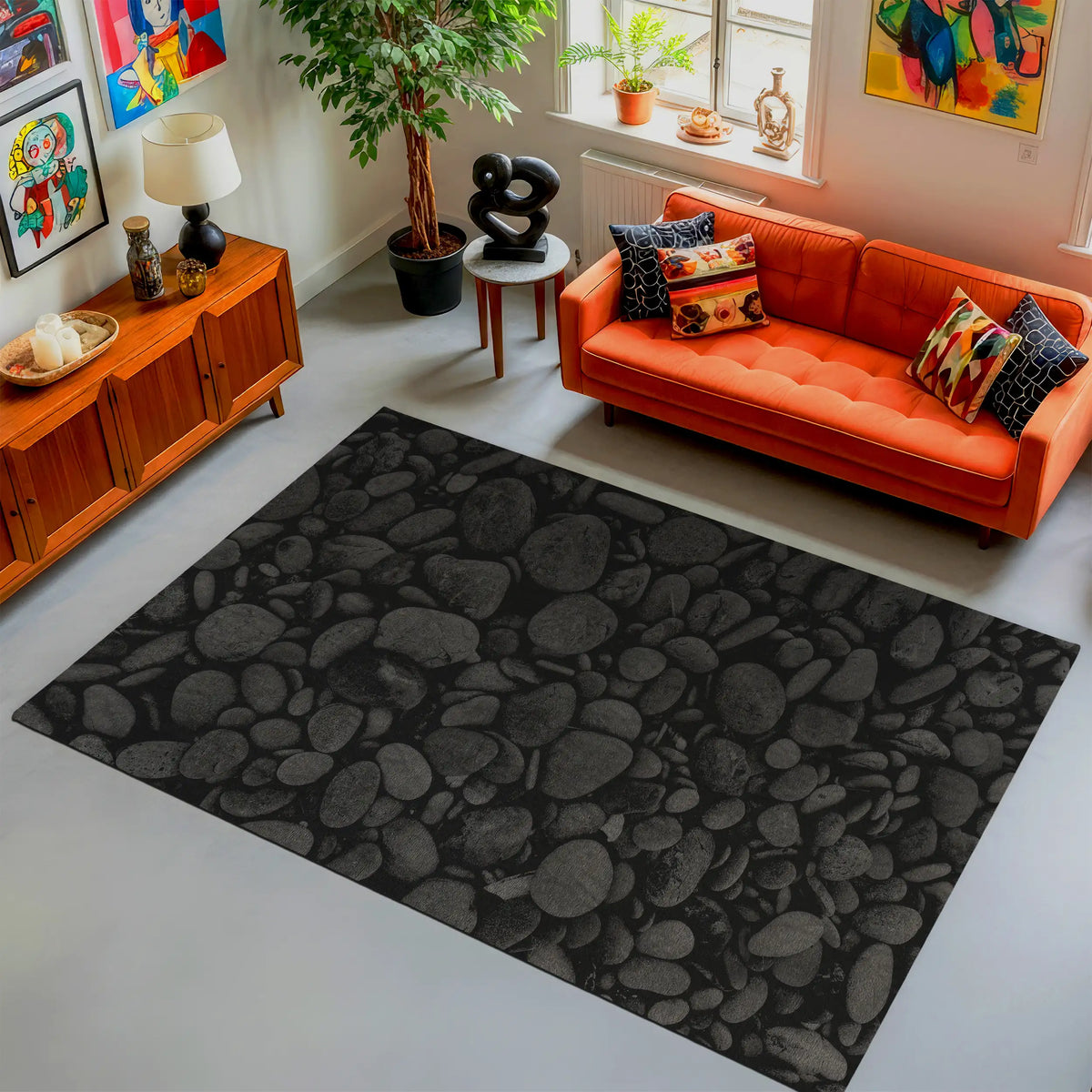 Living room with an orange sofa, black patterned rug, and decorative items.