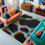Colorful living room with orange and teal sofas, a rainbow-patterned rug, and decorative items.