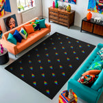 Living room with a black rug featuring rainbow triangles, orange and teal sofas, and colorful decor.