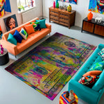 Colorful living room with an abstract rug, orange and blue sofas, and decorative items.