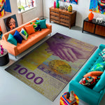 Living room with colorful furniture and a decorative rug featuring hands and currency design.

