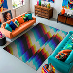 Living room with colorful rug, orange sofa, and turquoise chair.