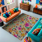 Colorful living room with orange and blue sofas, a floral rug, and decorative items.