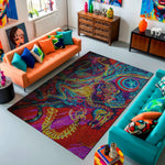 Colorful living room with orange and blue sofas, a vibrant rug, and decorative items.