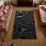 Colorful rug with a black background in a living room with patterned furniture.