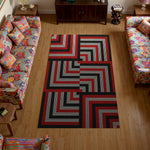 Living room with a geometric patterned rug on wooden floor

