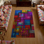 Colorful geometric rug on a wooden floor with patterned chairs.

