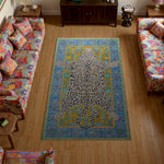 Colorful rug with a leopard design in a living room with patterned chairs.