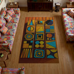 Colorful geometric patterned rug in a living room with floral sofas.


