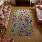Colorful floral rug in a living room with floral-patterned furniture.
